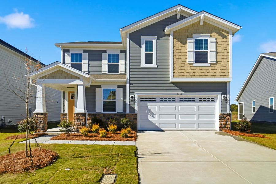 Front exterior of a new home in Waxhaw Landing, Monroe, NC, highlighting curb appeal (Image 1). Front exterior of a new home in Waxhaw Landing, Monroe, NC, highlighting curb appeal (Image 1).