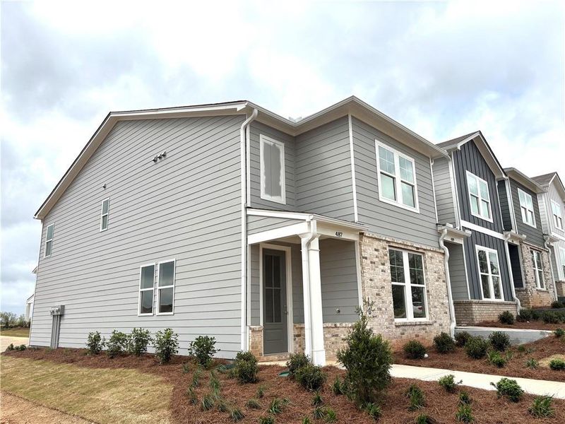 Front exterior of a new home in Stegall Village, Cartersville, GA, highlighting curb appeal (Image 23). Front exterior of a new home in Stegall Village, Cartersville, GA, highlighting curb appeal (Image 23).