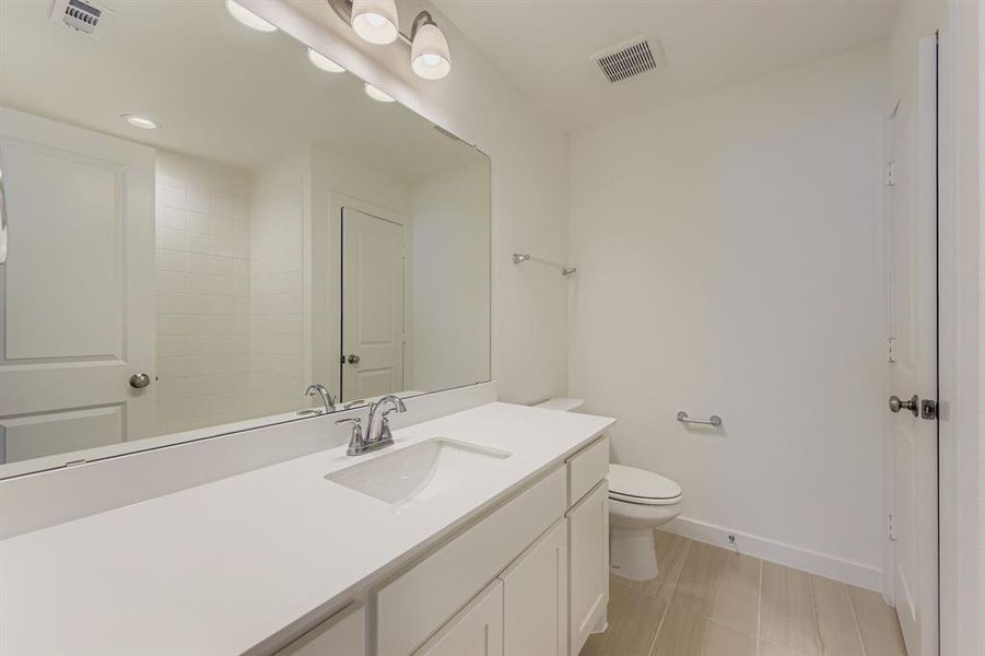 Bathroom with vanity and light tile patterned flooring Bathroom with vanity and light tile patterned flooring