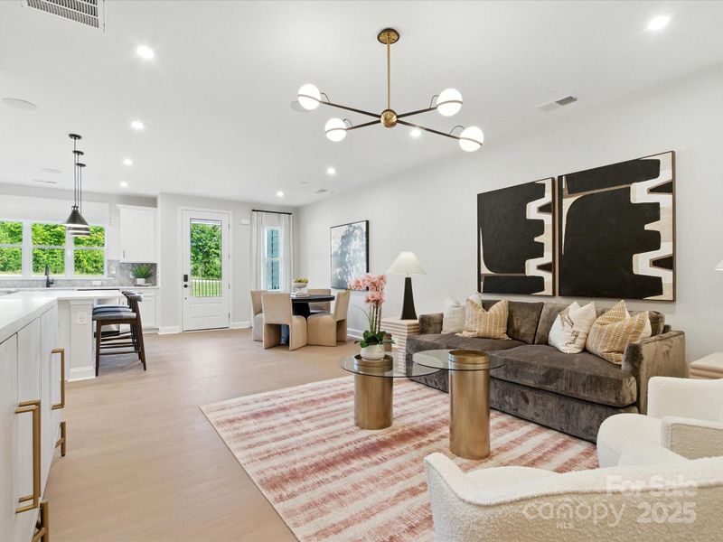 From the front entry, you are greeted by the dining and kitchen spaces. *Model Photos | Actual finishes, orientation, and structural selections may vary.