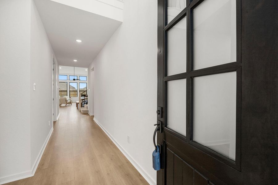 Beautiful frosted glass panel front door to welcome you into the large entry and hall.