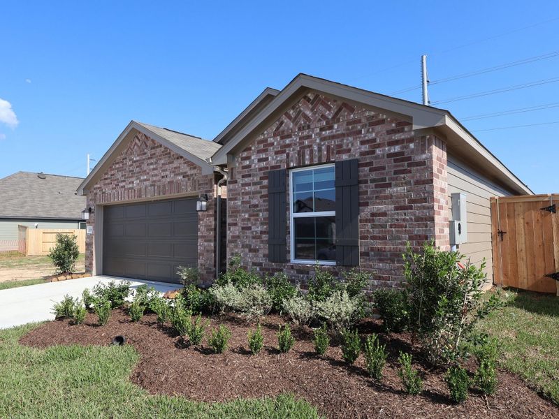 Front exterior of a new home in Ambrose, La Marque, TX, highlighting curb appeal (Image 14). Front exterior of a new home in Ambrose, La Marque, TX, highlighting curb appeal (Image 14).