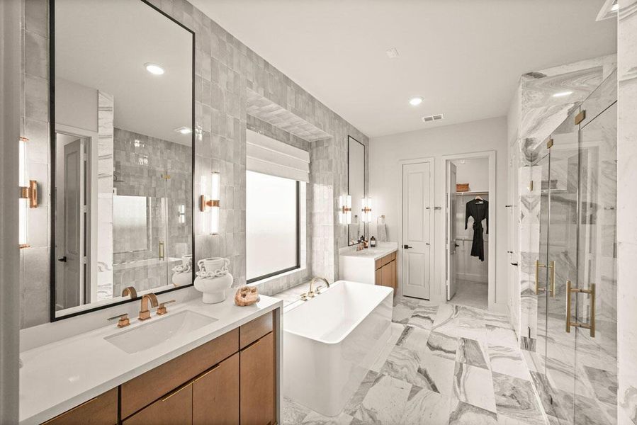 The main bath includes an enlarged spa-like shower. Representative image.