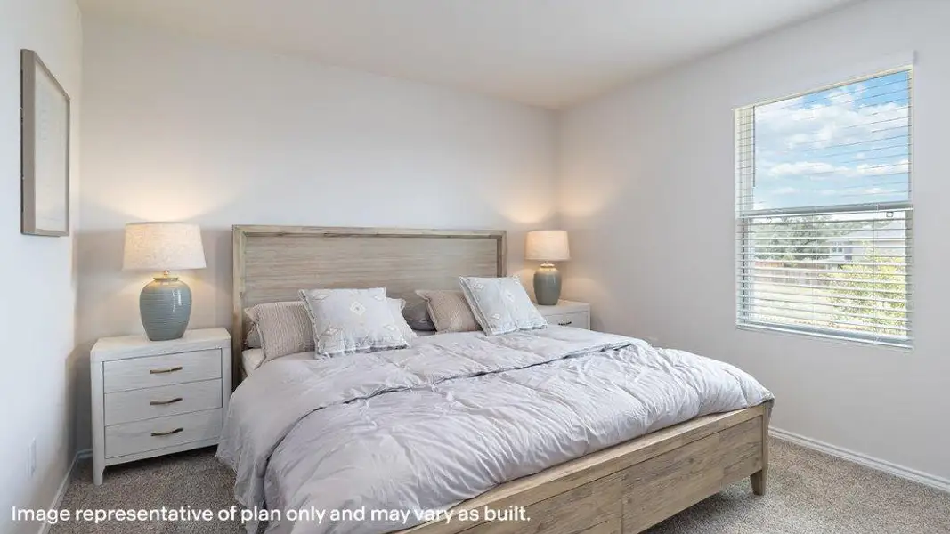Natural light filters into this serene bedroom, showcasing durable carpet and clean, neutral walls. Natural light filters into this serene bedroom, showcasing durable carpet and clean, neutral walls.