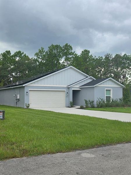 Front exterior of a new home in , Ocala, FL, highlighting curb appeal (Image 14).