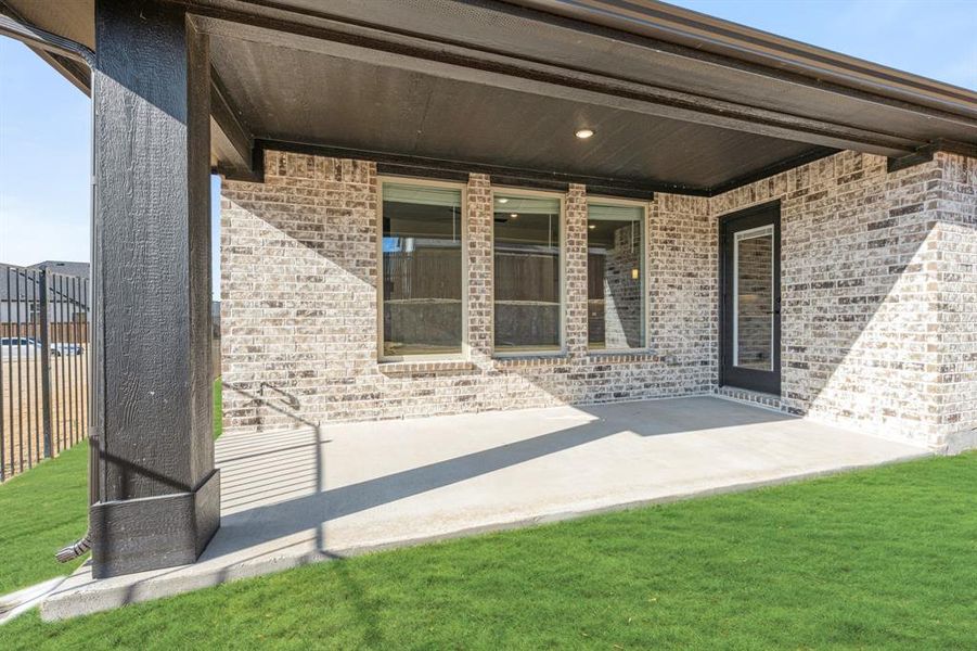 Exterior details and patio area of a home in Parks at Panchasarp Farms, Burleson (Image 20).
