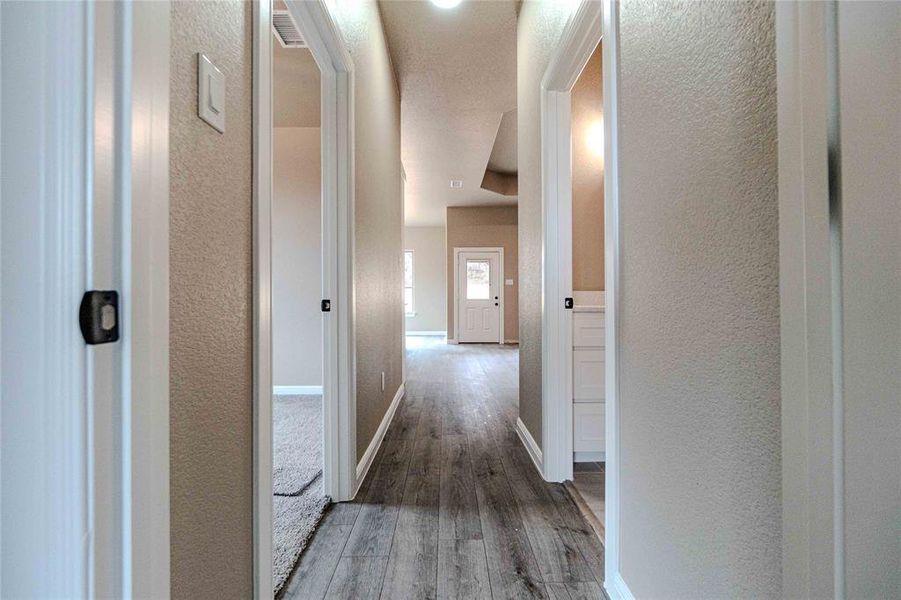 Hallway featuring hardwood / wood-style flooring