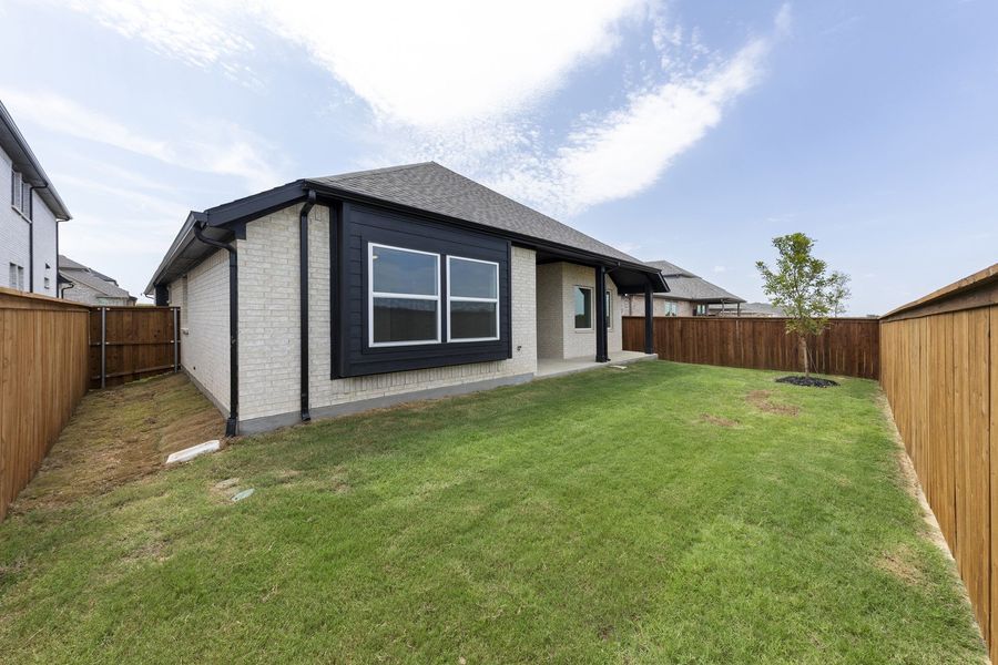 Exterior details and patio area of a home in Creekview Meadows, Pilot Point (Image 24).