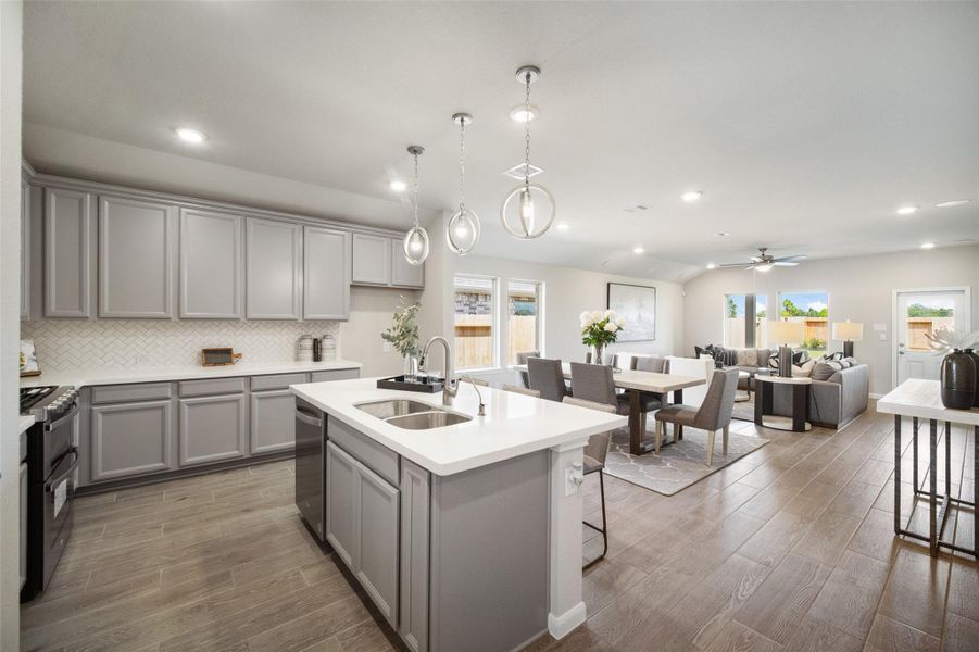 All of this overlooks your expansive family room, creating a perfect space for culinary delights and family gatherings! Sample photo of completed home with similar floor plan. Actual colors and selections may vary.