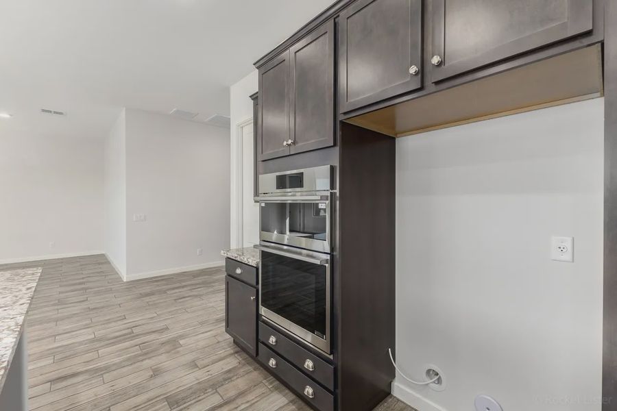 Furnished interior view inside a new home in Valencia at Granite Vista, Waddell (Image 9).
