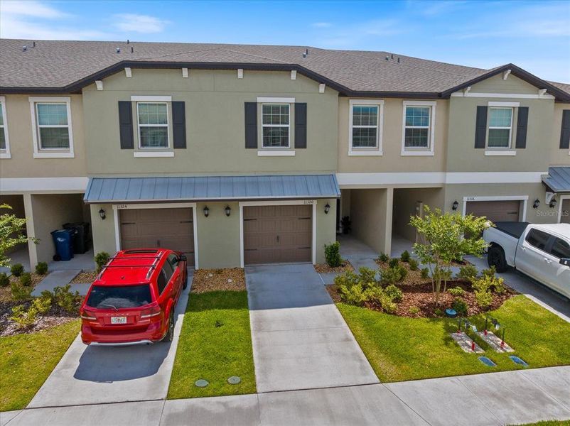 Front exterior of a new home in , Palmetto, FL, highlighting curb appeal (Image 24).