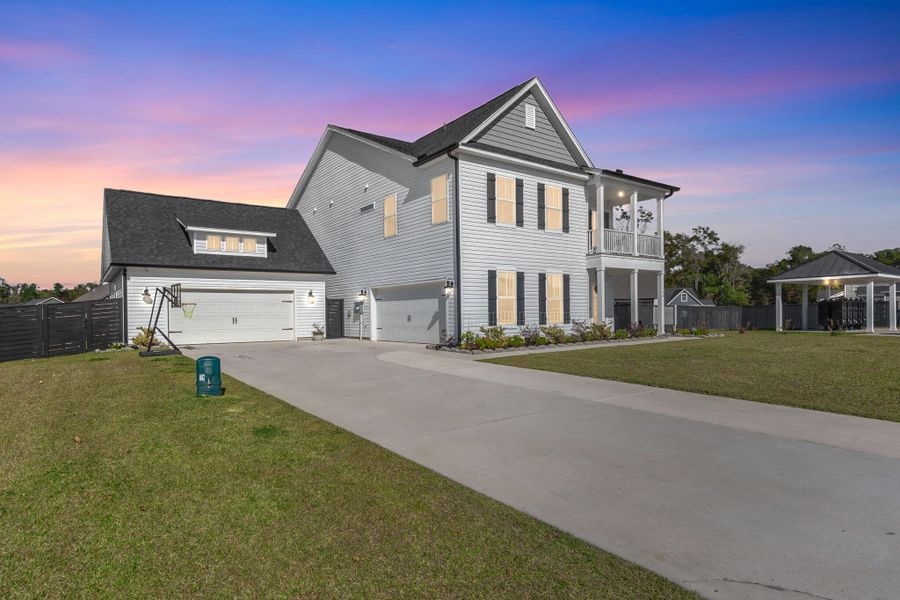 Front exterior of a new home in Timothy Lakes, Ridgeville, SC, highlighting curb appeal (Image 24). Front exterior of a new home in Timothy Lakes, Ridgeville, SC, highlighting curb appeal (Image 24).