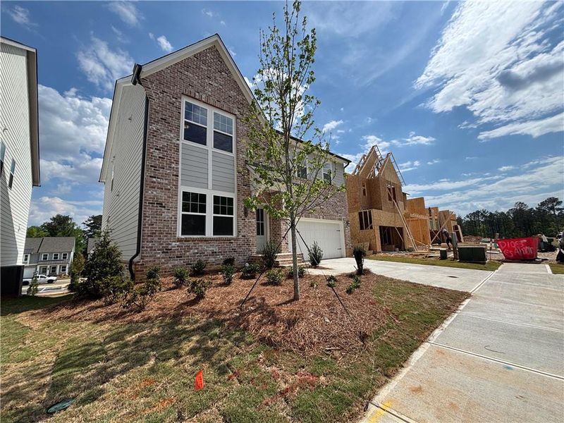 Exterior details and patio area of a home in Arbors at Richland Creek, Buford (Image 3).