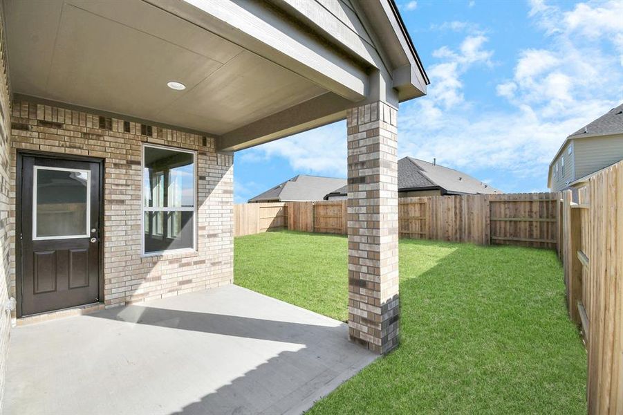 Experience outdoor living at its finest on this expansive covered patio,thoughtfully designed for BBQs and delightful outdoor dining.