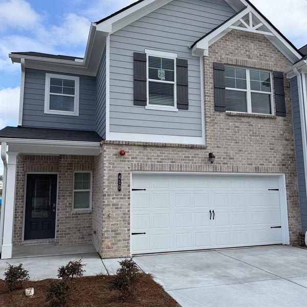 Front exterior of a new home in Chastain Heights, Woodstock, GA, highlighting curb appeal (Image 22).