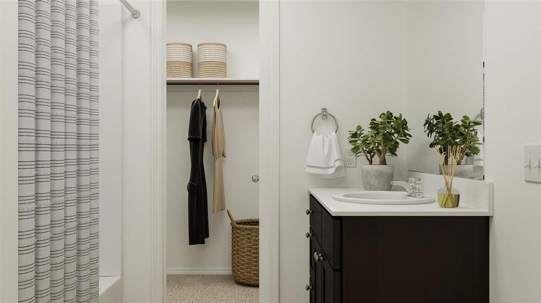 Bathroom with vanity and shower / bath combination with curtain