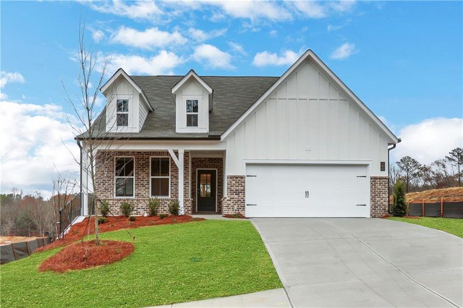 Front exterior of a new home in Cambridge at Steels Bridge, Canton, GA, highlighting curb appeal (Image 2). Front exterior of a new home in Cambridge at Steels Bridge, Canton, GA, highlighting curb appeal (Image 2).
