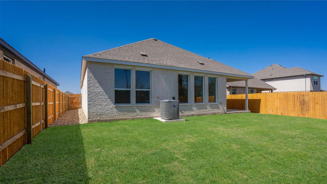 Front exterior of a new home in Rosenbusch Ranch, Leander, TX, highlighting curb appeal (Image 20). Front exterior of a new home in Rosenbusch Ranch, Leander, TX, highlighting curb appeal (Image 20).