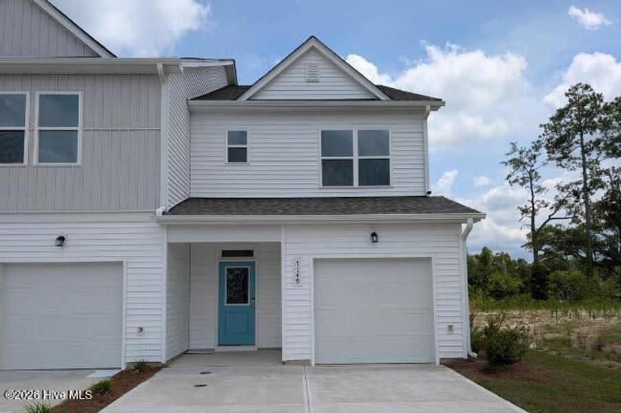 Front exterior of a new home in Coastal Haven, Leland, NC, highlighting curb appeal (Image 1). Front exterior of a new home in Coastal Haven, Leland, NC, highlighting curb appeal (Image 1).