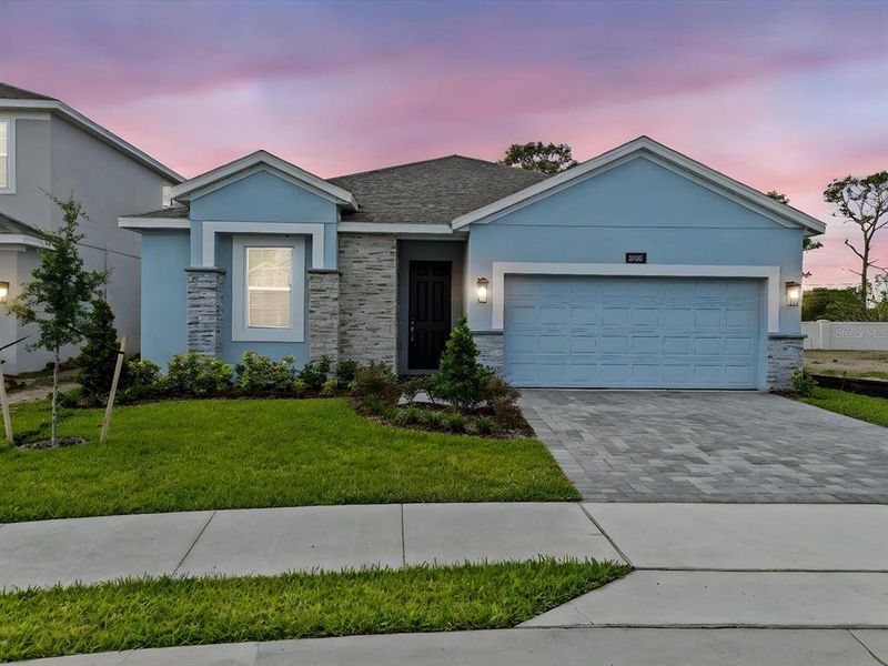 Front exterior of a new home in , Orlando, FL, highlighting curb appeal (Image 17).