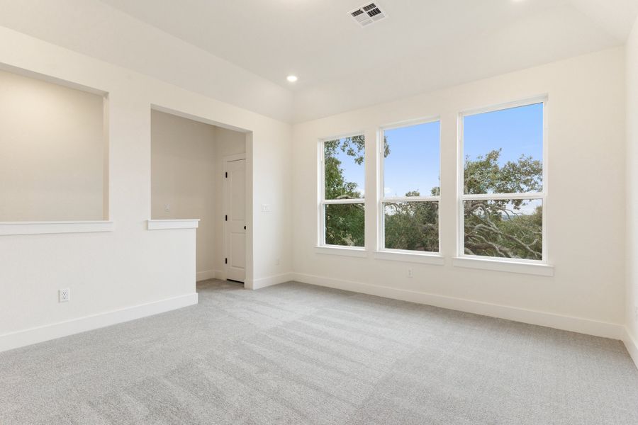 Representative unfurnished interior of a home built from the Waterville by Ashton Woods in The Trails at Carmel, Pflugerville (Image 53).
