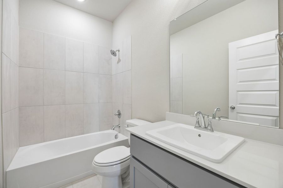 Bathroom in the Emmy II home plan by Trophy Signature Homes - REPRESENTATIVE PHOTO