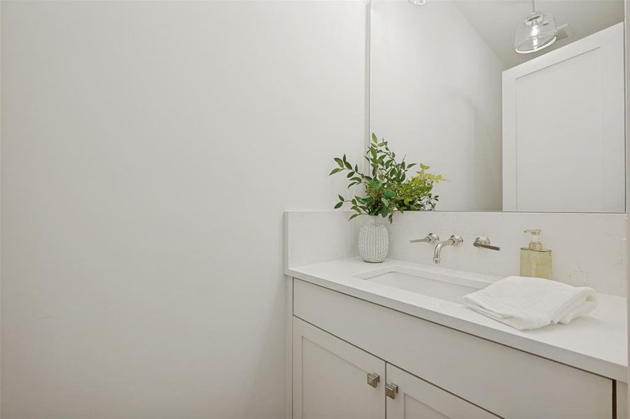 Conveniently located on the second floor, this powder bath provides easy access for guests and residents alike. Conveniently located on the second floor, this powder bath provides easy access for guests and residents alike.