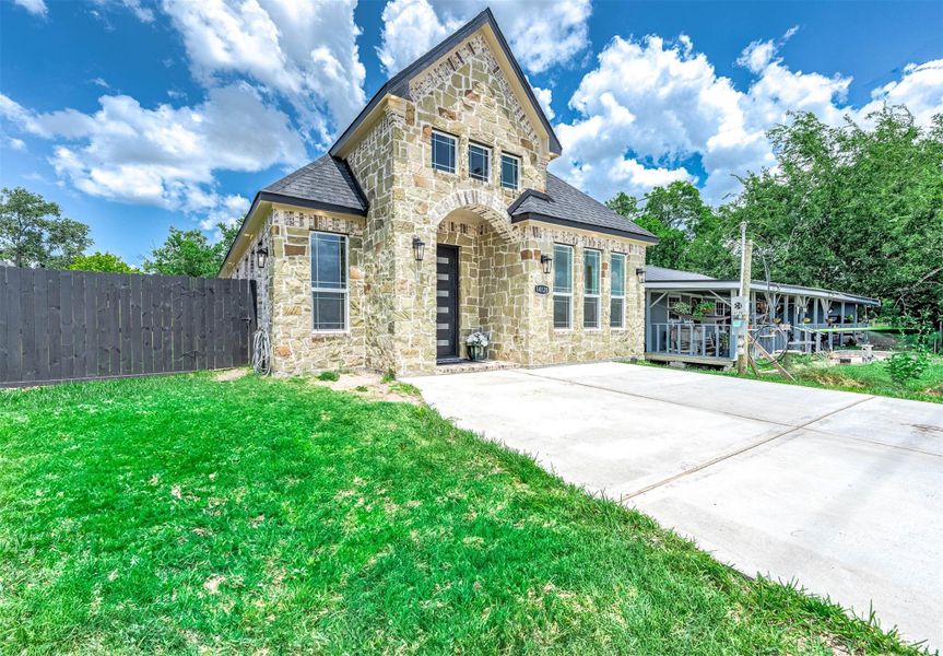 Front exterior of a new home in , Needville, TX, highlighting curb appeal (Image 2). Front exterior of a new home in , Needville, TX, highlighting curb appeal (Image 2).