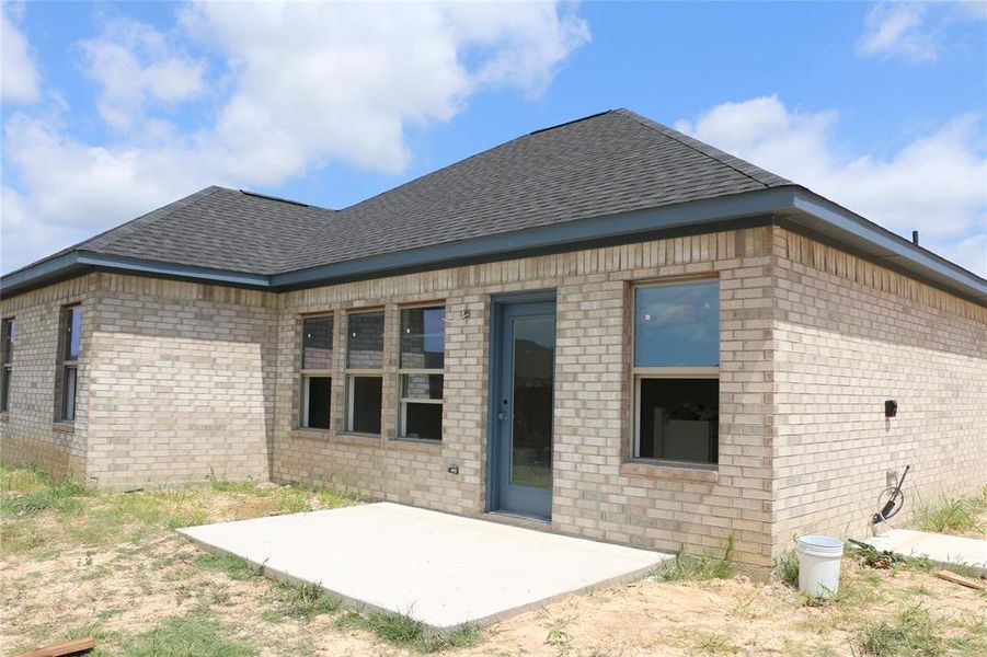 Back of house with a patio area