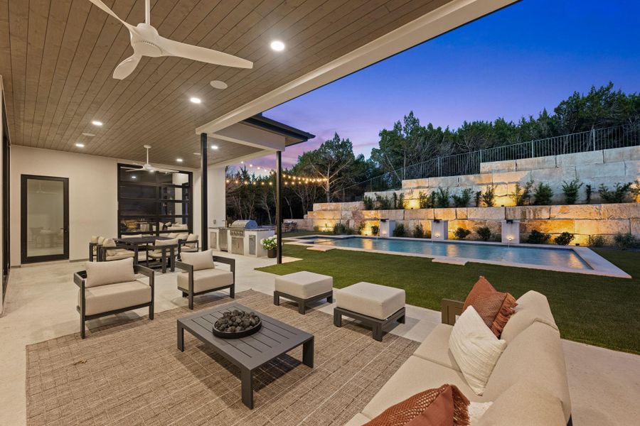An entertainer’s dream. The generous covered patio features a fully equipped outdoor kitchen for seamless al fresco dining