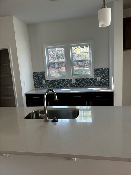 This modern kitchen features elegant countertops a