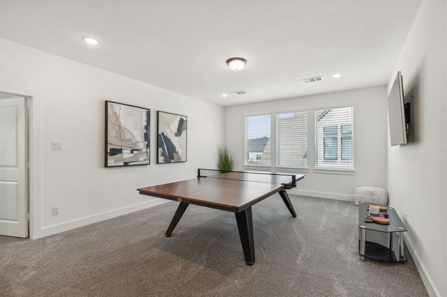 Game room featuring carpet floors