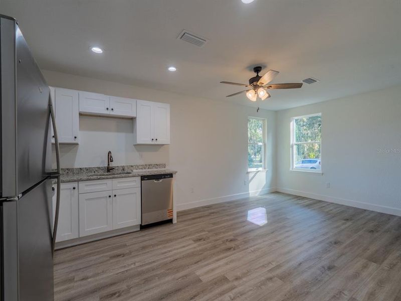 Spacious, unfurnished interior of a new home in , Fort McCoy (Image 9).