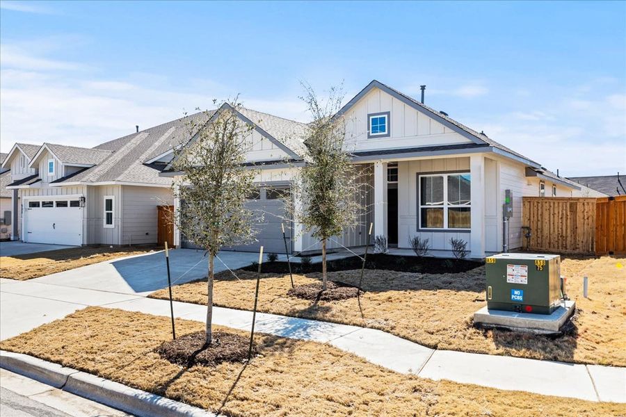 Front exterior of a new home in Trace, San Marcos, TX, highlighting curb appeal (Image 20). Front exterior of a new home in Trace, San Marcos, TX, highlighting curb appeal (Image 20).