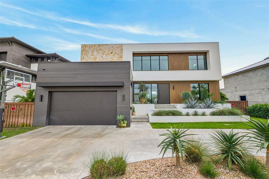 Front exterior of a new home in , St. Petersburg, FL, highlighting curb appeal (Image 25).