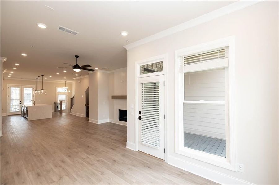 The Sunroom space is perfect to use as a extra sitting area which could also be used as office or reading room space- access right to deck.