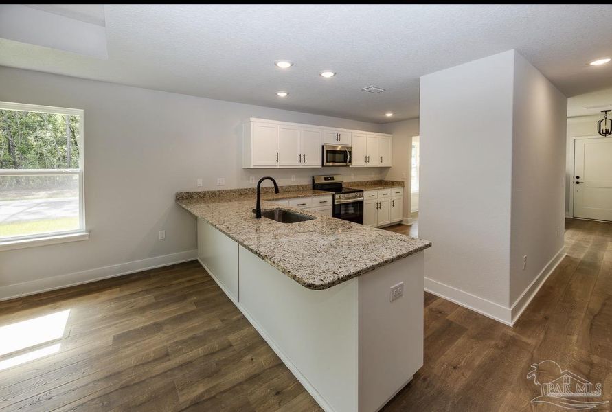 Furnished interior view inside a new home in Hidden Pines Estates, Milton (Image 4).