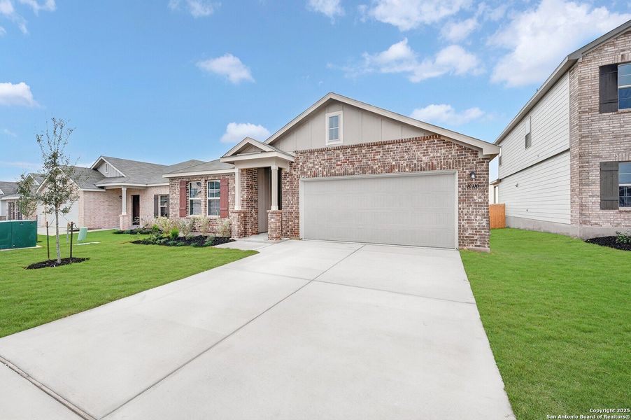 Front exterior of a new home in Paloma Park, Converse, TX, highlighting curb appeal (Image 19).