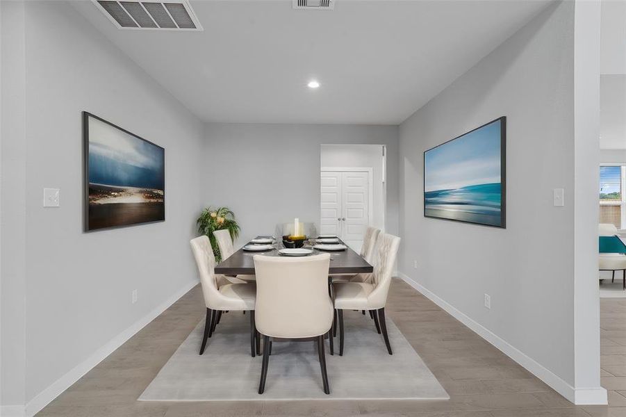 Make memories gathered around the table with your family and friends! This dining room features high ceilings, custom paint, gorgeous flooring and large windows with privacy blinds.