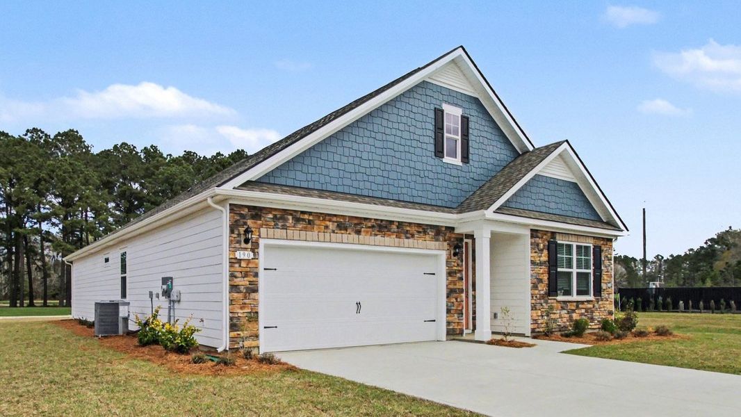 Front exterior of a new home in The Preserve at Shaftesbury Glen, Conway, SC, highlighting curb appeal (Image 20).