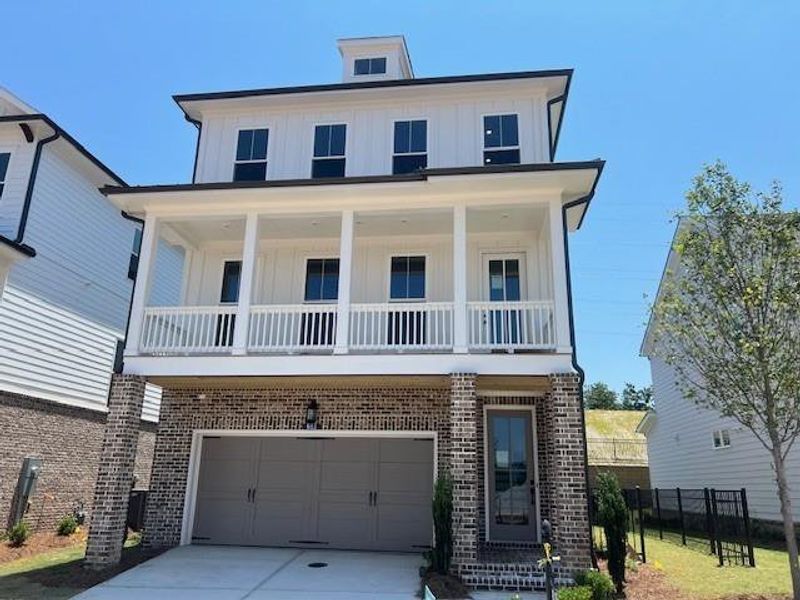 Front exterior of a new home in Palisades Single Family, Cumming, GA, highlighting curb appeal (Image 23).