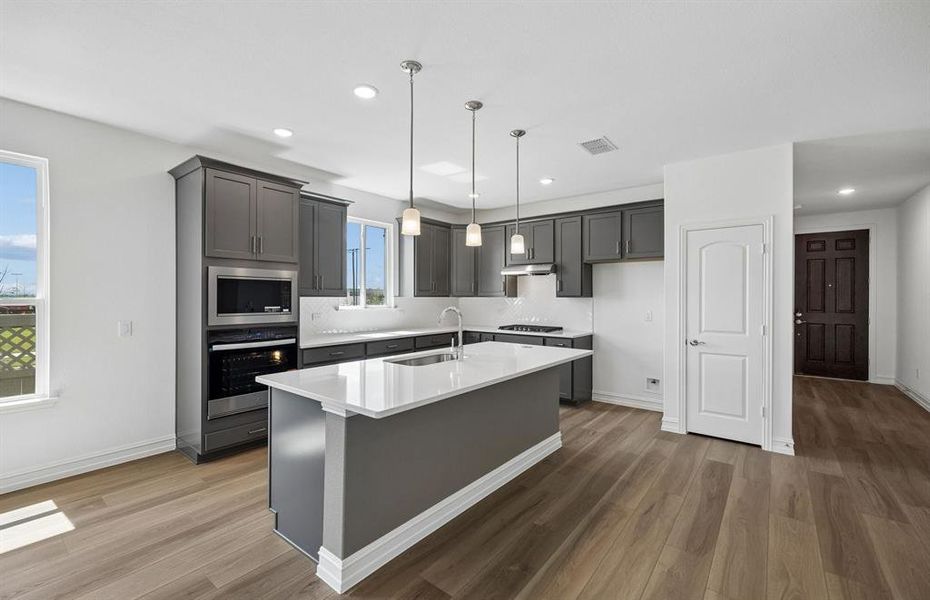 Spacious kitchen with abundant cabinet space Spacious kitchen with abundant cabinet space