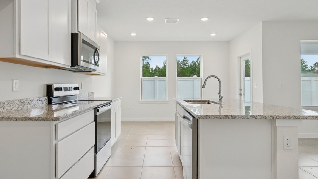 Kitchen of the Coronado - End at Cyrene at Harmony located in St Cloud FL by DRB Homes