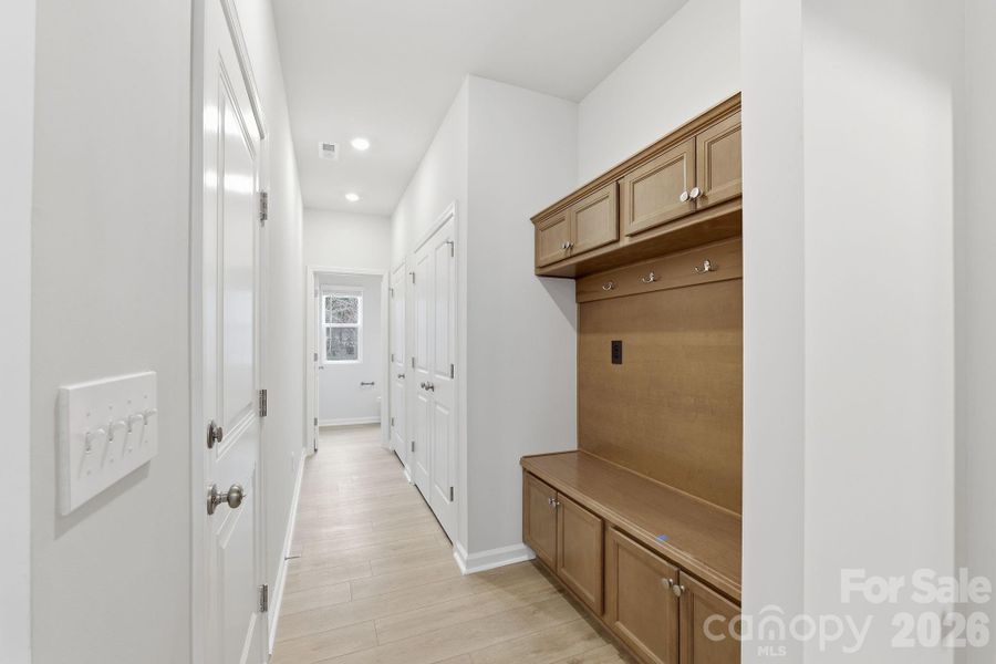 Drop Zone / Mud Room, hall features 2nd double-door pantry and coat closet. Drop Zone / Mud Room, hall features 2nd double-door pantry and coat closet.