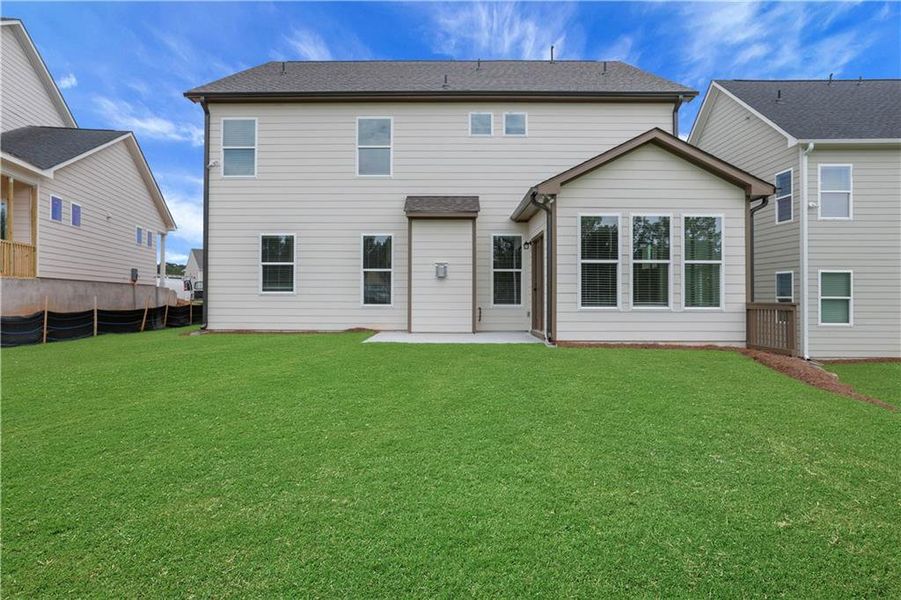 Front exterior of a new home in Twin Lakes, Hoschton, GA, highlighting curb appeal (Image 1).