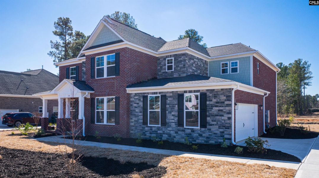 Front exterior of a new home in The Cove, Sumter, SC, highlighting curb appeal (Image 27).