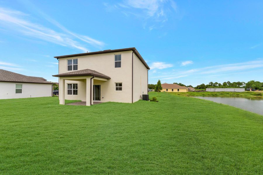 Front exterior of a new home in , Fort Pierce, FL, highlighting curb appeal (Image 2).
