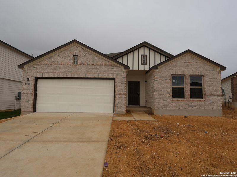 Front exterior of a new home in Winding Brook, San Antonio, TX, highlighting curb appeal (Image 2). Front exterior of a new home in Winding Brook, San Antonio, TX, highlighting curb appeal (Image 2).