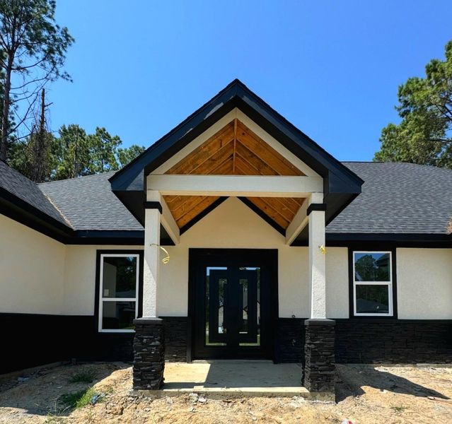 Front exterior of a new home in , Dayton, TX, highlighting curb appeal (Image 21).