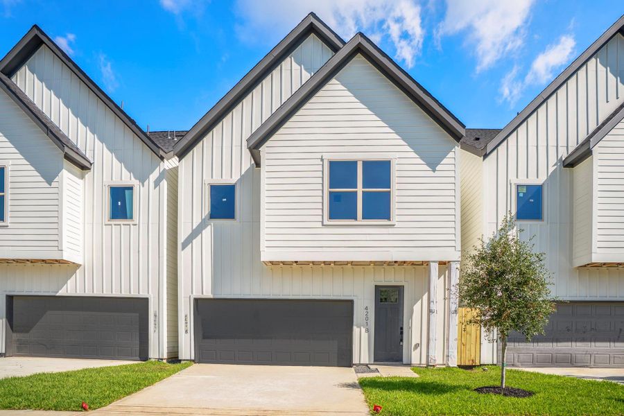 Front exterior of a new home in , Houston, TX, highlighting curb appeal (Image 1).